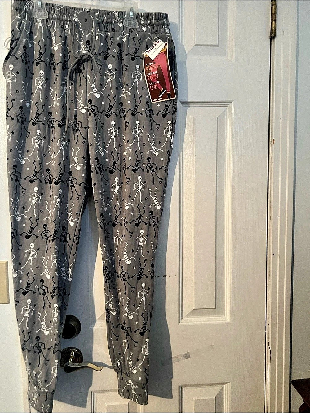 Fleece lines pajama pants with black and white skeletons NWT